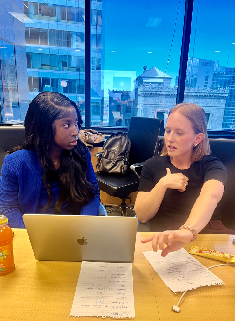 Monica McCann, an attorney at Parsons Behle, discusses resume pointers with University of Utah student Iradukunda Esperance